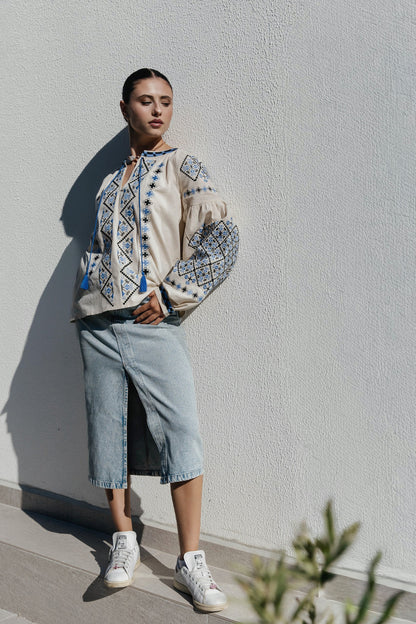 Blouse “Dyvotsvit” – Beige Linen Embroidered Blouse with Blue and Black Patterns and Tassels | Goya Concept