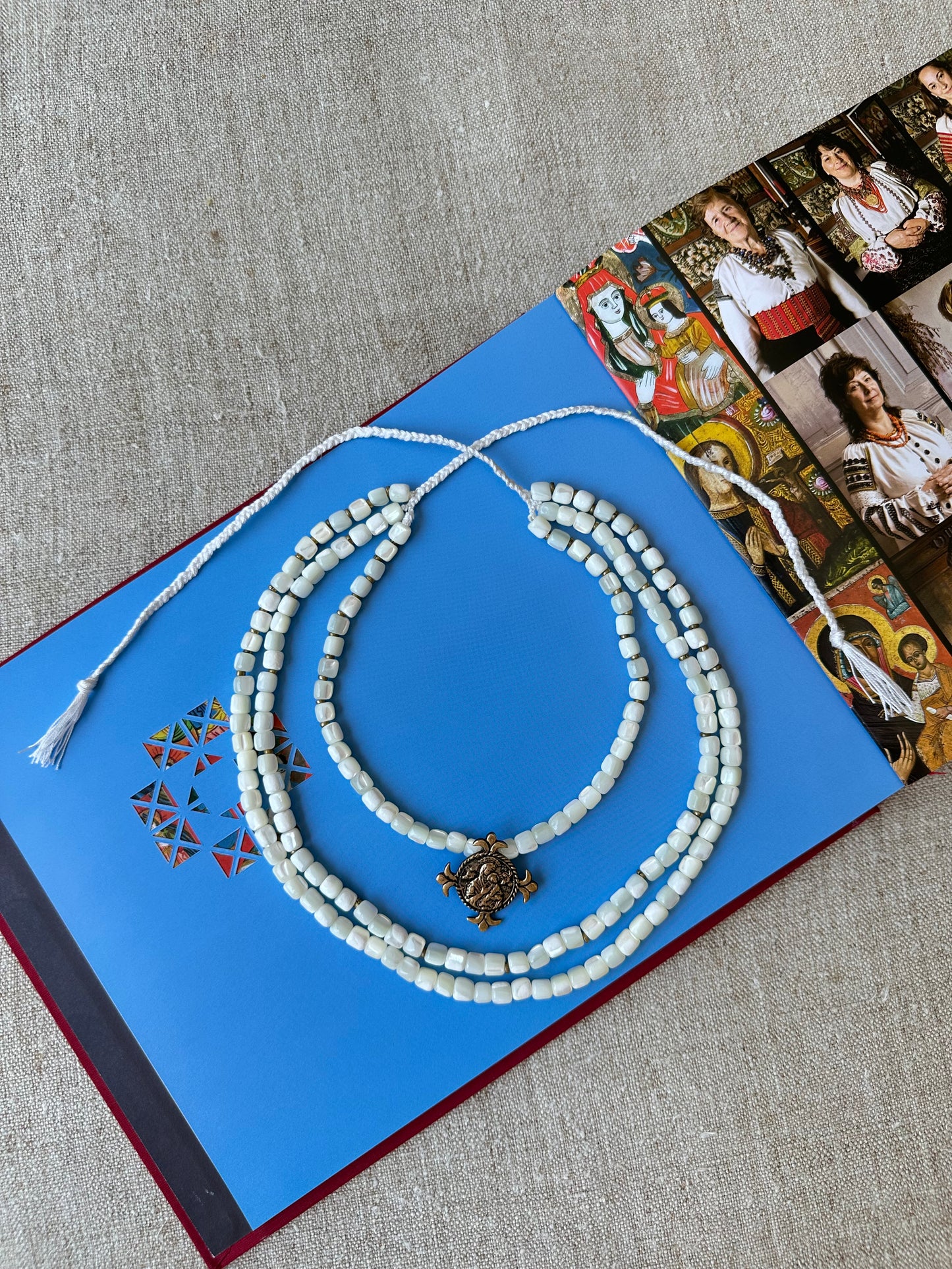 Three-Strand Mother-of-Pearl Necklace “Siaivo” — White Ukrainian Necklace with Dukach Pendant