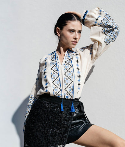 Blouse “Dyvotsvit” – Beige Linen Embroidered Blouse with Blue and Black Patterns and Tassels | Goya Concept