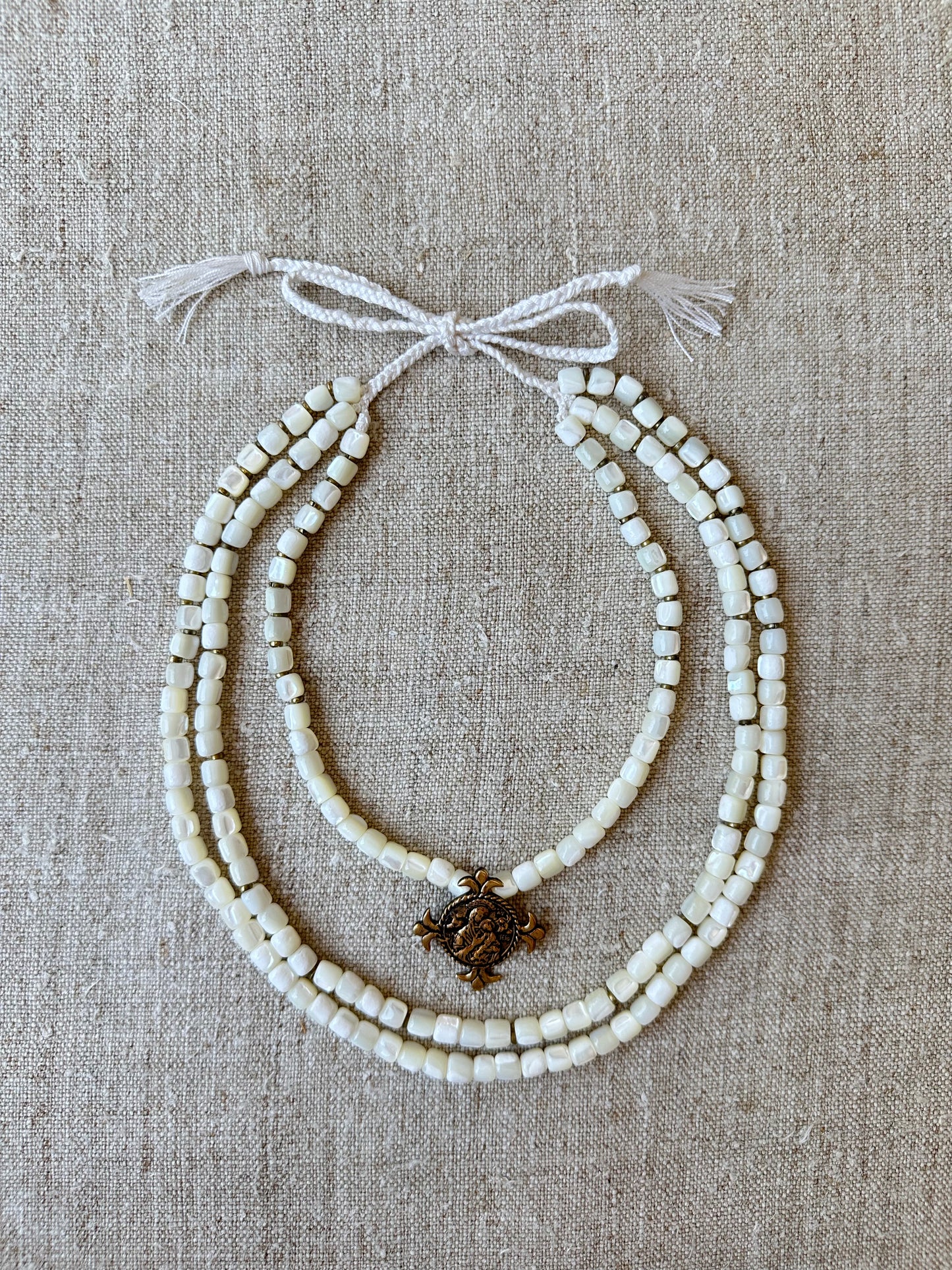 Three-Strand Mother-of-Pearl Necklace “Siaivo” — White Ukrainian Necklace with Dukach Pendant