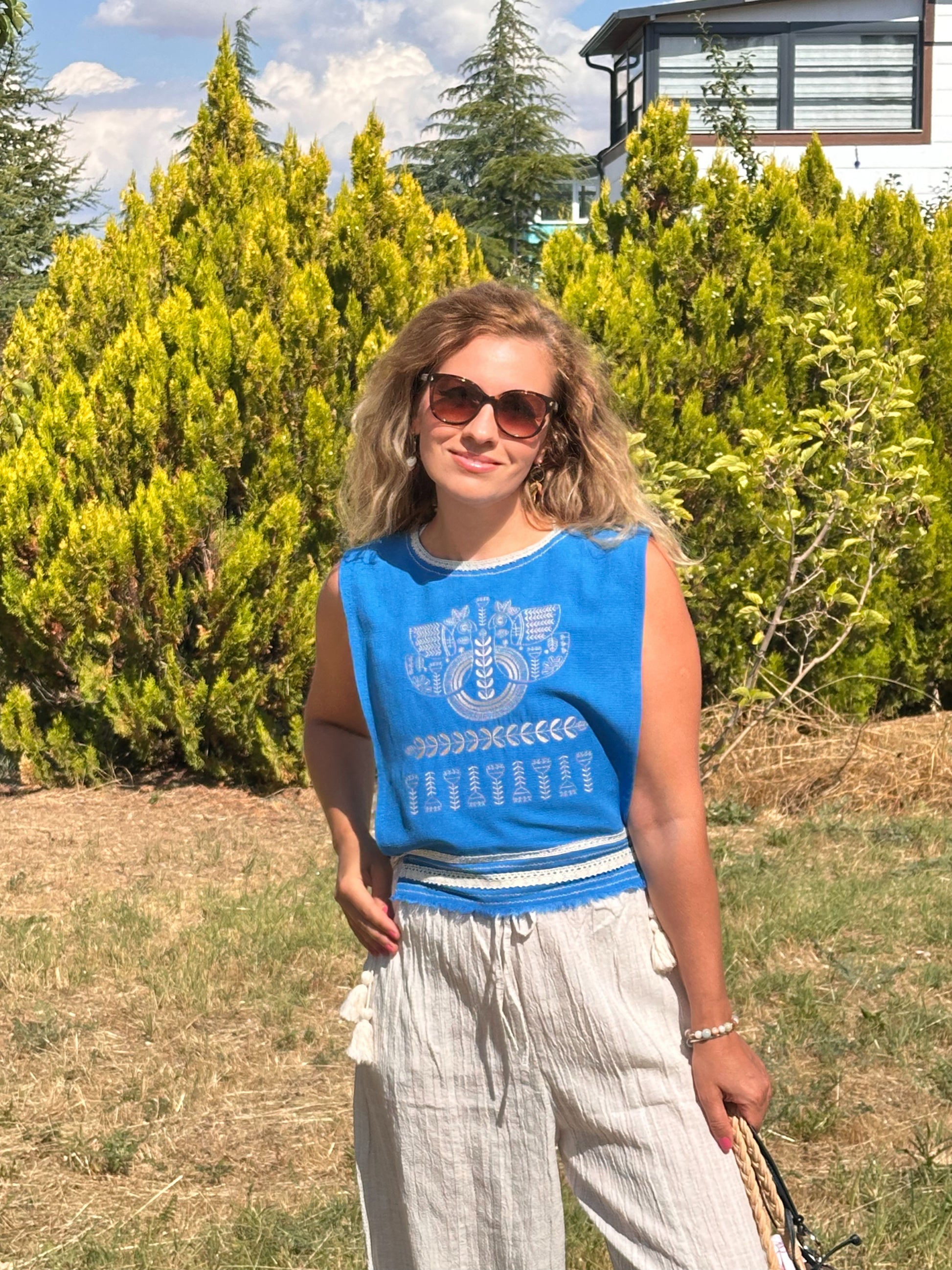     Blue embroidered side-tie top with handmade tassels