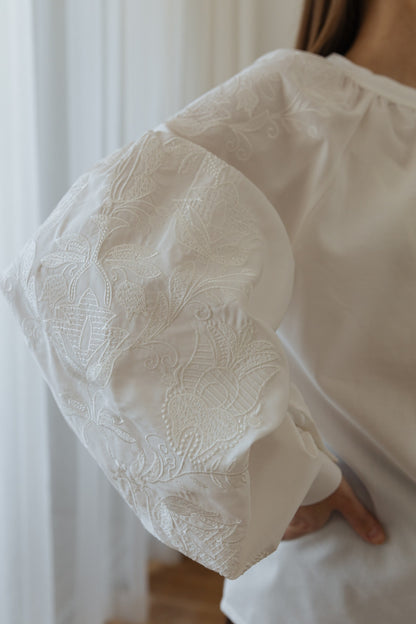 White Embroidered Blouse “Lileya” with Voluminous Sleeves and Vertical Pleated Panel