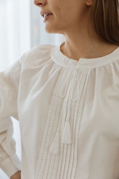 White Embroidered Blouse “Lileya” with Voluminous Sleeves and Vertical Pleated Panel